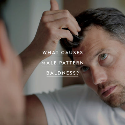 What causes male pattern baldness?